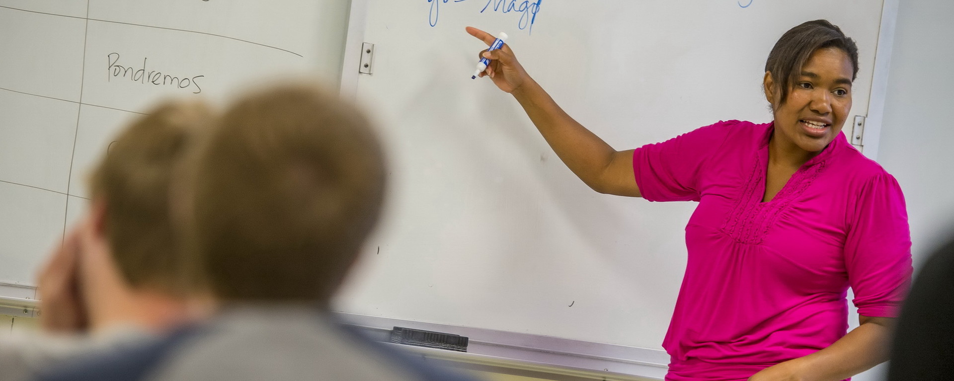 A professor explains something at the board.